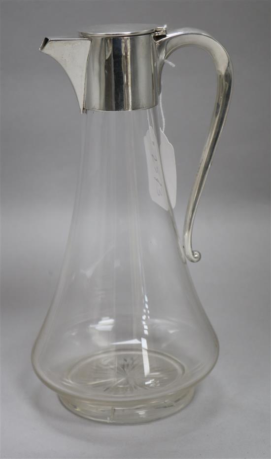 An Edwardian silver-mounted cut glass claret jug, H 24cm approx